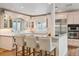 Beautiful kitchen with a breakfast bar, modern appliances, and custom cabinetry at 600 Vine St, Denver, CO 80206