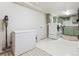 Bright laundry room featuring modern appliances and ample cabinet space at 600 Vine St, Denver, CO 80206