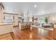 Open layout with a kitchen island, stainless steel appliances, and a cozy living room at 600 Vine St, Denver, CO 80206