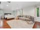 Spacious main bedroom boasts a seating area, plush rug, and bright windows at 600 Vine St, Denver, CO 80206