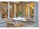 Cozy outdoor patio with a table and chairs, perfect for relaxing and enjoying the view at 600 Vine St, Denver, CO 80206
