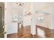 Bright living room with hardwood floors, white walls, and large windows, creating a welcoming atmosphere at 2308 Dogwood Dr, Erie, CO 80516