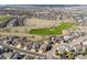 Stunning aerial view of the residential neighborhood with a golf course at 1863 Rose Petal Ct, Castle Rock, CO 80109