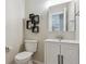 Clean bathroom with modern fixtures, a white vanity, and decorative wall shelves at 1863 Rose Petal Ct, Castle Rock, CO 80109