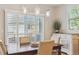 Dining room features decorative lighting, a window with shutters and wood table with upholstered chairs at 1863 Rose Petal Ct, Castle Rock, CO 80109