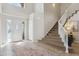 Inviting foyer with tile flooring, a grand staircase, and abundant natural light at 1863 Rose Petal Ct, Castle Rock, CO 80109