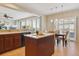 Open concept kitchen featuring island with views into the dining and living rooms at 1863 Rose Petal Ct, Castle Rock, CO 80109