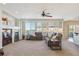 Spacious living room featuring a fireplace, large windows, and comfortable seating at 1863 Rose Petal Ct, Castle Rock, CO 80109