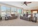 Bright living room features neutral carpet, large windows, and comfortable seating at 1863 Rose Petal Ct, Castle Rock, CO 80109