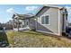 Landscaped backyard with patio and privacy fence at 9914 Truckee St, Commerce City, CO 80022