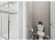 Clean bathroom with a toilet, shower, and modern fixtures at 9914 Truckee St, Commerce City, CO 80022