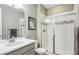 Clean bathroom with a large shower and modern vanity at 9914 Truckee St, Commerce City, CO 80022