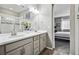 Double vanity bathroom with modern gray cabinets and a shower at 9914 Truckee St, Commerce City, CO 80022