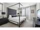 Spacious bedroom with a large canopy bed and plenty of light at 9914 Truckee St, Commerce City, CO 80022