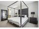Bright bedroom featuring a comfortable king-size bed and ensuite bathroom at 9914 Truckee St, Commerce City, CO 80022