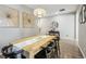 Modern dining room with a large wood table and stylish decor at 9914 Truckee St, Commerce City, CO 80022