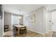 Bright dining room features a wood table, bench, and chairs at 9914 Truckee St, Commerce City, CO 80022