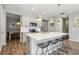 Modern kitchen with stainless steel appliances and an island at 9914 Truckee St, Commerce City, CO 80022