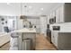 Modern kitchen with stainless steel appliances and an island at 9914 Truckee St, Commerce City, CO 80022