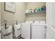 Convenient laundry room with washer, dryer, and storage at 9914 Truckee St, Commerce City, CO 80022