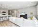 Open concept living room with comfortable seating and kitchen views at 9914 Truckee St, Commerce City, CO 80022