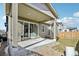 Covered patio with sliding glass doors leading to the interior at 9914 Truckee St, Commerce City, CO 80022