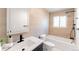 Bathroom featuring vanity, shower, and soaking tub with modern fixtures at 1486 S Kingston St, Aurora, CO 80012