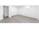 Bright bedroom with modern gray flooring, white trim and plenty of closet space at 1486 S Kingston St, Aurora, CO 80012