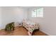 bedroom with a large window and hardwood floors at 1486 S Kingston St, Aurora, CO 80012