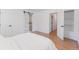 Bright bedroom with a sliding barn door to the bathroom and large closet at 1486 S Kingston St, Aurora, CO 80012
