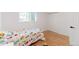 bedroom with hardwood floors and a bright window at 1486 S Kingston St, Aurora, CO 80012