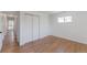 Bright bedroom with a large closet, hardwood floors, and a bright window at 1486 S Kingston St, Aurora, CO 80012