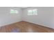 Bright bedroom featuring hardwood floors and large bright windows at 1486 S Kingston St, Aurora, CO 80012