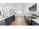 Stylish kitchen showcasing stainless steel appliances, granite countertops, and open view to dining area at 1486 S Kingston St, Aurora, CO 80012