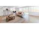 Bright living room featuring an open layout, modern furnishings, and large windows overlooking the backyard at 1486 S Kingston St, Aurora, CO 80012