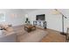 Comfortable living room showcasing neutral tones, stylish furnishings, and natural light from multiple windows at 1486 S Kingston St, Aurora, CO 80012