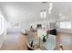 Spacious living area with open design, featuring contemporary decor, hardwood floors, and abundant natural light at 1486 S Kingston St, Aurora, CO 80012