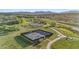 Aerial view of a community with pickleball courts, paths, and lush green spaces perfect for recreation at 2154 Concord Ln, Superior, CO 80027