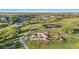 Aerial view of a community featuring a skate park, tennis courts and walking paths amid green landscape at 2154 Concord Ln, Superior, CO 80027