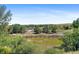Home offers backyard view with a pond, landscaping, park, and trees at 2154 Concord Ln, Superior, CO 80027