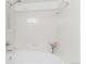 Bright bathroom showcasing shower over tub with all white tile and chrome fixtures at 2154 Concord Ln, Superior, CO 80027