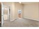 Primary bedroom with two doors to the bathroom and laundry, and one doorway to the bathroom at 2154 Concord Ln, Superior, CO 80027