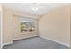 Bedroom with a large window providing natural light and a neutral color scheme at 2154 Concord Ln, Superior, CO 80027