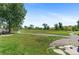 Dog park featuring lush green lawn, fenced area, and walking paths at 2154 Concord Ln, Superior, CO 80027