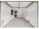 Spacious garage with storage shelves and door to the house at 2154 Concord Ln, Superior, CO 80027
