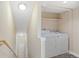 Laundry area equipped with a washer, dryer, and shelving at 2154 Concord Ln, Superior, CO 80027