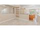 Living room with built-in shelving and an open layout to the kitchen area at 2154 Concord Ln, Superior, CO 80027