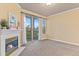 Spacious living room with a fireplace, balcony access, and natural light at 2154 Concord Ln, Superior, CO 80027