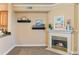 Cozy living room featuring a fireplace, built-in shelves, and open layout at 2154 Concord Ln, Superior, CO 80027