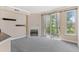 Carpeted living room with a fireplace and sliding glass doors leading to a balcony at 2154 Concord Ln, Superior, CO 80027